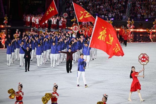 (251109) -- GUANGZHOU, Nov. 9, 2025 (Xinhua) -- Members of Fujian delegation parade during the opening ceremony of China's 15th National Games in Guangzhou, south China's Guangdong Province, Nov. 9, 2025. (Xinhua/Deng Hua)