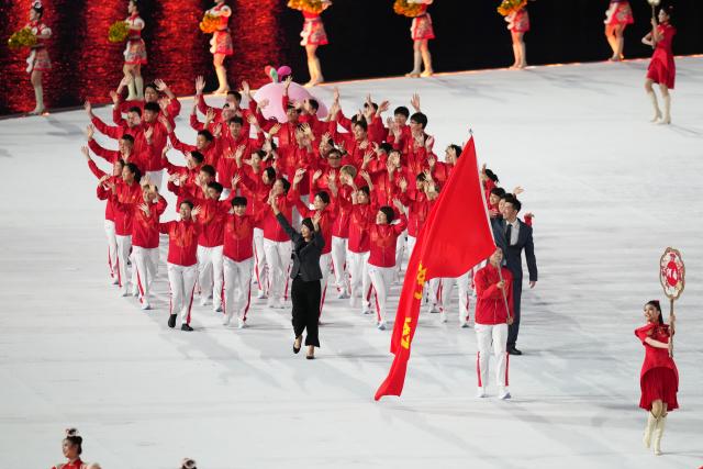 (251109) -- GUANGZHOU, Nov. 9, 2025 (Xinhua) -- Members of Henan delegation parade during the opening ceremony of China's 15th National Games in Guangzhou, south China's Guangdong Province, Nov. 9, 2025. (Xinhua/Xue Yuge)