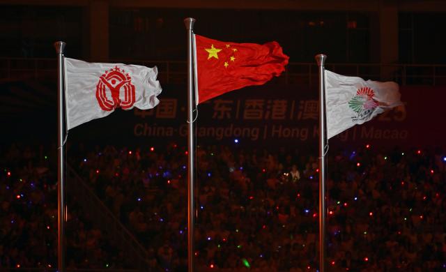 (251109) -- GUANGZHOU, Nov. 9, 2025 (Xinhua) -- Flags are raised during the opening ceremony of China's 15th National Games in Guangzhou, south China's Guangdong Province, Nov. 9, 2025. (Xinhua/Xiao Yijiu)