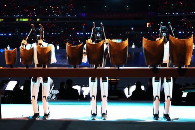 (251109) -- GUANGZHOU, Nov. 9, 2025 (Xinhua) -- Robots perform during the opening ceremony of China's 15th National Games in Guangzhou, south China's Guangdong Province, Nov. 9, 2025. (Xinhua/Luo Yuan)