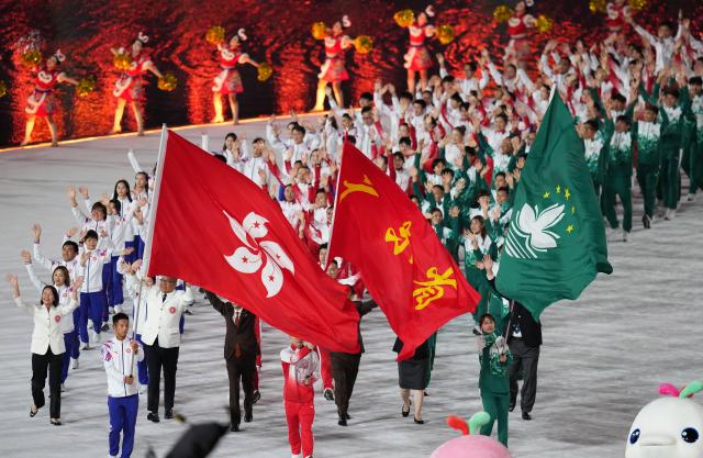 (251109) -- GUANGZHOU, Nov. 9, 2025 (Xinhua) -- Members of Guangdong, Hong Kong and Macao delegations parade during the opening ceremony of China's 15th National Games in Guangzhou, south China's Guangdong Province, Nov. 9, 2025. (Xinhua/Lai Xiangdong)