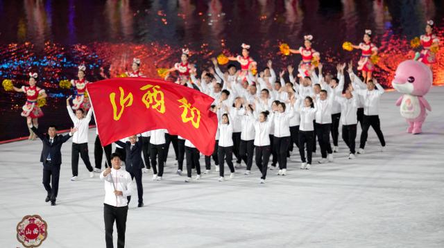 (251109) -- GUANGZHOU, Nov. 9, 2025 (Xinhua) -- Members of Shanxi delegation parade during the opening ceremony of China's 15th National Games in Guangzhou, south China's Guangdong Province, Nov. 9, 2025. (Xinhua/Lai Xiangdong)