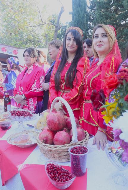 (251110) -- GOYCHAY, Nov. 10, 2025 (Xinhua) -- Women dressed in local ethnic festive costumes are pictured during the Nar Bayrami pomegranate festival in Goychay, Azerbaijan, Nov. 9, 2025. Azerbaijan's annual Nar Bayrami pomegranate festival was held here on Sunday. The festival was inscribed on the UNESCO Representative List of the Intangible Cultural Heritage of Humanity in 2020. (Xinhua/Chen Junfeng)