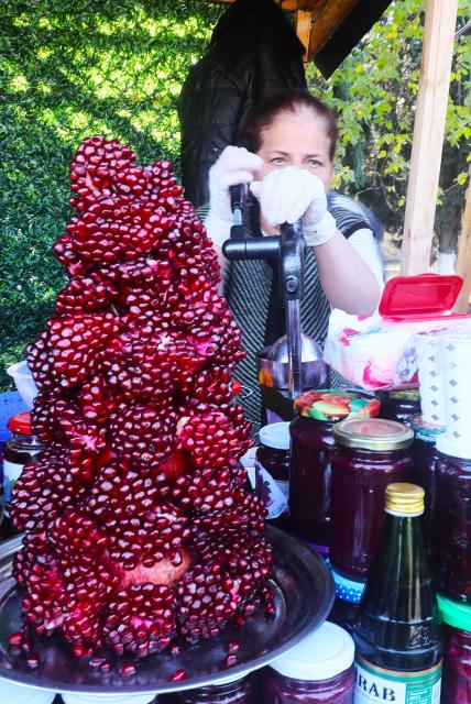 (251110) -- GOYCHAY, Nov. 10, 2025 (Xinhua) -- Pomegranates are placed in front of a pomegranate juice stall during the Nar Bayrami pomegranate festival in Goychay, Azerbaijan, Nov. 9, 2025. Azerbaijan's annual Nar Bayrami pomegranate festival was held here on Sunday. The festival was inscribed on the UNESCO Representative List of the Intangible Cultural Heritage of Humanity in 2020. (Xinhua/Chen Junfeng)