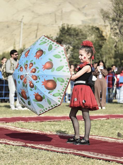 (251110) -- GOYCHAY, Nov. 10, 2025 (Xinhua) -- A pomegranate-themed children's fashion show is held during the Nar Bayrami pomegranate festival in Goychay, Azerbaijan, Nov. 9, 2025. Azerbaijan's annual Nar Bayrami pomegranate festival was held here on Sunday. The festival was inscribed on the UNESCO Representative List of the Intangible Cultural Heritage of Humanity in 2020. (Xinhua/Chen Junfeng)
