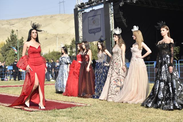 (251110) -- GOYCHAY, Nov. 10, 2025 (Xinhua) -- A fashion show featuring pomegranate-themed designs is held during the Nar Bayrami pomegranate festival in Goychay, Azerbaijan, Nov. 9, 2025. Azerbaijan's annual Nar Bayrami pomegranate festival was held here on Sunday. The festival was inscribed on the UNESCO Representative List of the Intangible Cultural Heritage of Humanity in 2020. (Xinhua/Chen Junfeng)