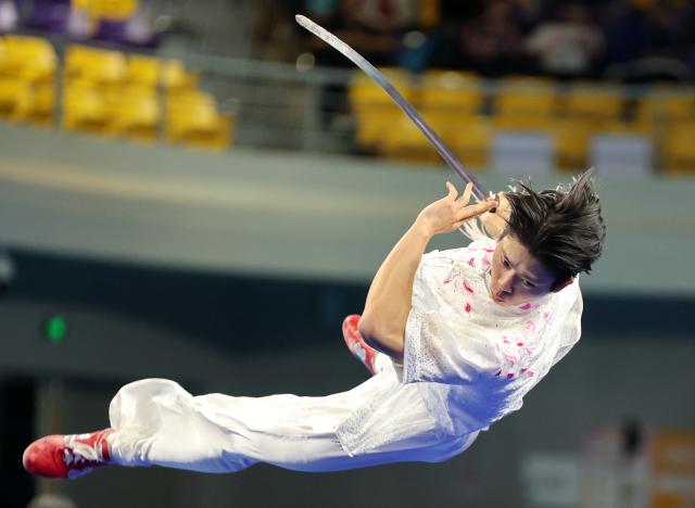 (251110) -- GUANGZHOU, Nov. 10, 2025 (Xinhua) -- Dou Zhengchun of Guangdong competes during the men's Jianshu competition of Wushu Taolu team event at China's 15th National Games in Guangzhou, south China's Guangdong Province, Nov. 10, 2025. (Xinhua/Yang Shiyao)