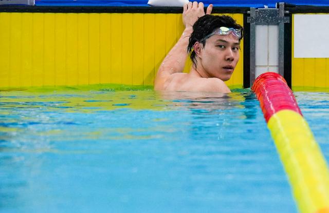 (251110) -- SHENZHEN, Nov. 10, 2025 (Xinhua) -- Qin Haiyang of Shanghai reacts after the men's 100m breaststroke preliminary of swimming event at China's 15th National Games in Shenzhen, south China's Guangdong Province, Nov. 10, 2025. (Xinhua/Tenzin Nyida)