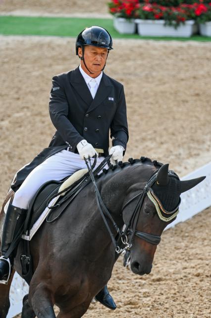 (251110) -- SHENZHEN, Nov. 10, 2025 (Xinhua) -- Liu Zhong of Xinjiang competes during the equestrian dressage team final at China's 15th National Games in Shenzhen, south China's Guangdong Province, Nov. 10, 2025. (Xinhua/Lian Zhen)