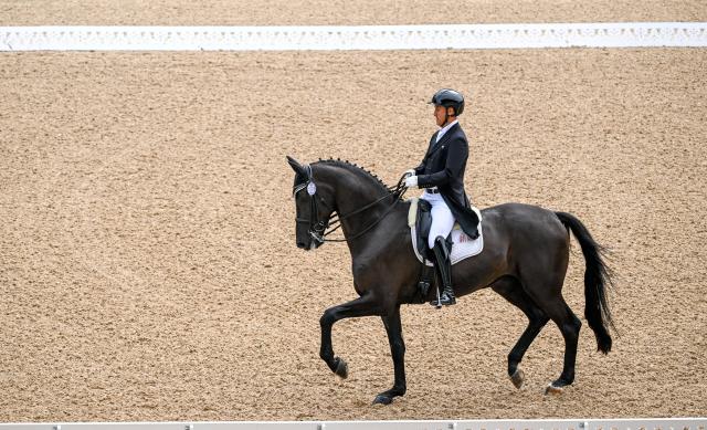 (251110) -- SHENZHEN, Nov. 10, 2025 (Xinhua) -- Liu Tao of Xinjiang competes during the equestrian dressage team final at China's 15th National Games in Shenzhen, south China's Guangdong Province, Nov. 10, 2025. (Xinhua/Lian Zhen)