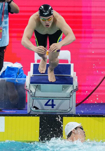 (251110) -- SHENZHEN, Nov. 10, 2025 (Xinhua) -- Pan Zhanle (top) of team Zhejiang starts during the men's 4X100m freestyle relay final of swimming event at China's 15th National Games in Shenzhen, south China's Guangdong Province, Nov. 10, 2025. (Xinhua/Du Yu)
