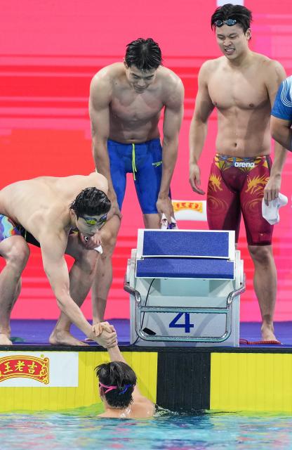 (251110) -- SHENZHEN, Nov. 10, 2025 (Xinhua) -- Team Zhejiang celebrate after the men's 4X100m freestyle relay final of swimming event at China's 15th National Games in Shenzhen, south China's Guangdong Province, Nov. 10, 2025. (Xinhua/Du Yu)
