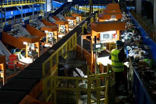 (251110) -- HARBIN, Nov. 10, 2025 (Xinhua) -- Staff members sort parcels at a branch of China Post in Harbin, northeast China's Heilongjiang Province, Nov. 10, 2025. With the "Double Eleven" online shopping festival approaching, a branch of China Post in Harbin has taken measures to ensure package delivery. (Xinhua/Zhang Tao)