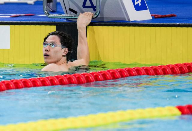 (251110) -- SHENZHEN, Nov. 10, 2025 (Xinhua) -- Qin Haiyang of Shanghai reacts after the men's 100m breaststroke semifinal of swimming event at China's 15th National Games in Shenzhen, south China's Guangdong Province, Nov. 10, 2025. (Xinhua/Tenzin Nyida)