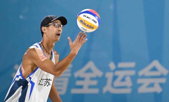 (251110) -- HONG KONG, Nov. 10, 2025 (Xinhua) -- Wu Jiaxin of Jiangsu competes during the beach volleyball men's final between Wu Jiaxin/Zhou Chaowei of Jiangsu and Li Zhuoxin/Xue Tao of Liaoning at China's 15th National Games in Hong Kong, south China, Nov. 10, 2025. (Xinhua/Hu Huhu)