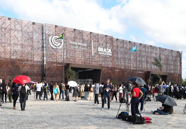 (251110) -- BELEM(BRAZIL), Nov. 10, 2025 (Xinhua) -- Participants arrive at the venue of the 30th United Nations climate change conferencein Belem, Brazil, Nov. 10, 2025. The 30th United Nations climate change conference, commonly known as COP30, opened Monday in Belem, in the Brazilian state of Para, with the aim of putting the fight against climate change back in the center of international priorities, according to local authorities. (Photo by Claudia Martini/Xinhua)