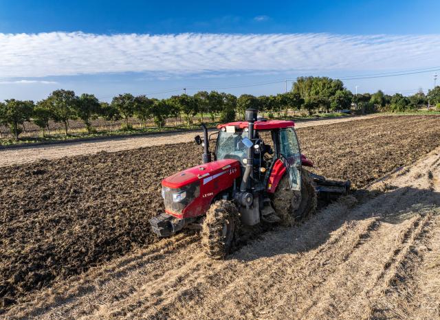 (251111) -- BEIJING, Nov. 11, 2025 (Xinhua) -- A drone photo taken on Nov. 11, 2025 shows a farmer operating an agricultural machine to plough a field in preparation of sowing winter wheat in Chenbao Town of Xinghua City, east China's Jiangsu Province. As of Nov. 10, nearly 70 percent of the winter wheat has been sowed across the country. (Photo by Zhou Shegen/Xinhua)