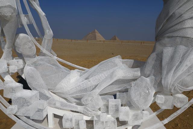 (251111) -- CAIRO, Nov. 11, 2025 (Xinhua) -- An artistic installation is displayed during the "Forever Is Now" international art exhibition at Giza Pyramids scenic spot in Giza, Egypt, Nov. 11, 2025. The fifth edition of "Forever Is Now" international art exhibition on Tuesday kicked off in the area of Egypt's Giza Pyramids scenic spot, showcasing 10 artworks of artists from different countries. The exhibition runs from Nov. 11 to Dec. 6. (Xinhua/Ahmed Gomaa)
