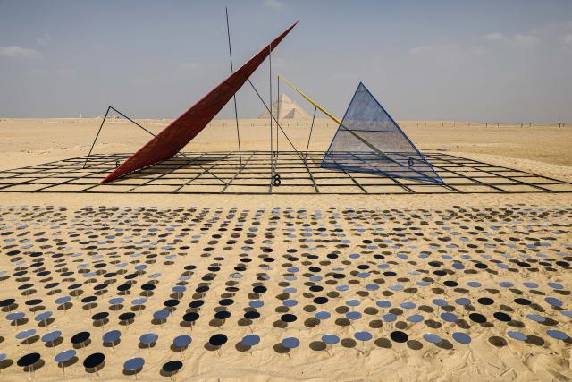 (251111) -- CAIRO, Nov. 11, 2025 (Xinhua) -- An artistic installation is displayed during the "Forever Is Now" international art exhibition at Giza Pyramids scenic spot in Giza, Egypt, Nov. 11, 2025. The fifth edition of "Forever Is Now" international art exhibition on Tuesday kicked off in the area of Egypt's Giza Pyramids scenic spot, showcasing 10 artworks of artists from different countries. The exhibition runs from Nov. 11 to Dec. 6. (Xinhua/Ahmed Gomaa)