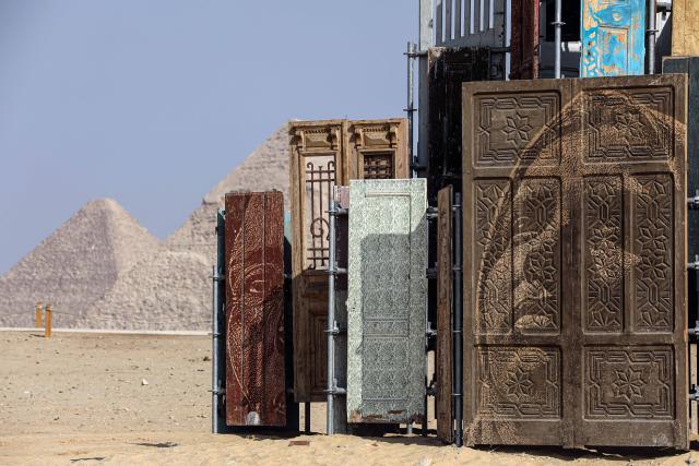 (251111) -- CAIRO, Nov. 11, 2025 (Xinhua) -- An artistic installation is displayed during the "Forever Is Now" international art exhibition at Giza Pyramids scenic spot in Giza, Egypt, Nov. 11, 2025. The fifth edition of "Forever Is Now" international art exhibition on Tuesday kicked off in the area of Egypt's Giza Pyramids scenic spot, showcasing 10 artworks of artists from different countries. The exhibition runs from Nov. 11 to Dec. 6. (Xinhua/Ahmed Gomaa)