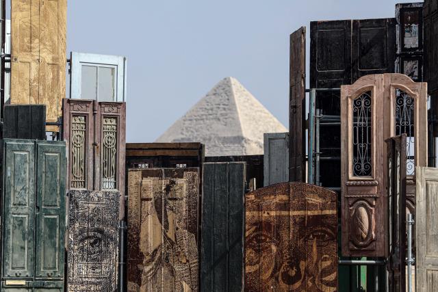 (251111) -- CAIRO, Nov. 11, 2025 (Xinhua) -- An artistic installation is displayed during the "Forever Is Now" international art exhibition at Giza Pyramids scenic spot in Giza, Egypt, Nov. 11, 2025. The fifth edition of "Forever Is Now" international art exhibition on Tuesday kicked off in the area of Egypt's Giza Pyramids scenic spot, showcasing 10 artworks of artists from different countries. The exhibition runs from Nov. 11 to Dec. 6. (Xinhua/Ahmed Gomaa)