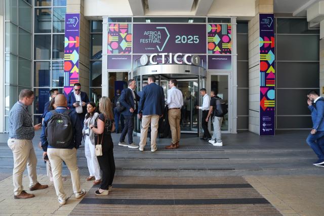(251111) -- CAPE TOWN, Nov. 11, 2025 (Xinhua) -- People arrive the Cape Town International Convention Center (CTICC) to attend the Africa Tech Festival 2025 in Cape Town, South Africa, Nov. 11, 2025. The Africa Tech Festival kicked off on Tuesday in Cape Town, the legislative capital of South Africa, gathering innovators, policymakers, and investors to explore how technology can drive a more inclusive digital future for Africa. (Photo by Shakirah Thebus/Xinhua)
