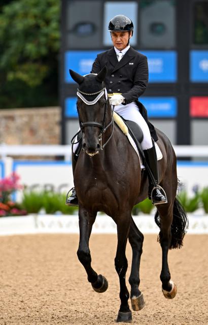 (251112) -- SHENZHEN, Nov. 12, 2025 (Xinhua) -- Liu Tao of Xinjiang competes during the equestrian dressage individual final at China's 15th National Games in Shenzhen, south China's Guangdong Province, Nov. 12, 2025. (Xinhua/Feng Kaihua)