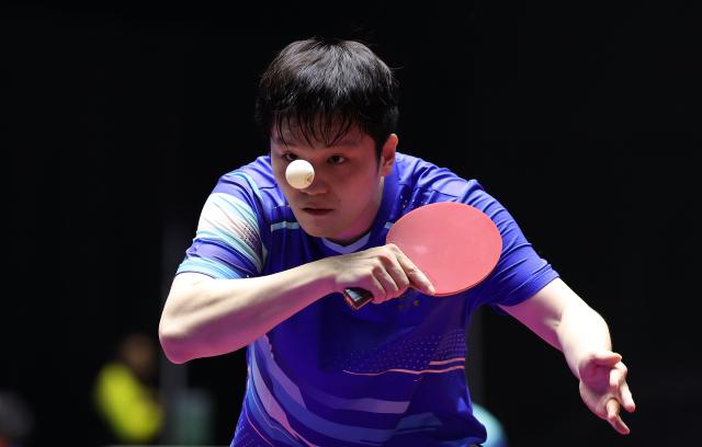 (251112) -- MACAO, Nov. 12, 2025 (Xinhua) -- Fan Zhendong serves during the table tennis men's singles round of 16 match between Fan Zhendong of Shanghai and Xue Fei of Hubei at China's 15th National Games in Macao, south China, Nov. 12, 2025. (Xinhua/Liang Xu)