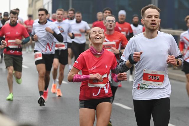 (251112) -- WARSAW, Nov. 12, 2025 (Xinhua) -- People take part in the Independence Day Run as part of the Independence Day celebrations in Warsaw, Poland on Nov. 11, 2025. (Photo by Aleksy Witwicki/Xinhua)