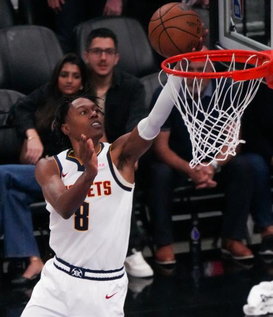 (251112) -- SACRAMENTO, Nov. 12, 2025 (Xinhua) -- Peyton Watson of Denver Nuggets goes for a layup during the 2025-2026 NBA regular season match between Sacramento Kings and Denver Nuggets in Sacramento, the United States, Nov. 11, 2025. (Photo by Sun Yuxuan/Xinhua)