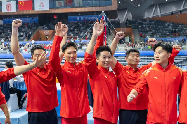 (251112) -- ZHAOQING, Nov. 12, 2025 (Xinhua) -- Team Jiangsu celebrate after the artistic gymnastics men's team final at China's 15th National Games in Zhaoqing, south China's Guangdong Province, Nov. 12, 2025. (Xinhua/Du Zixuan)