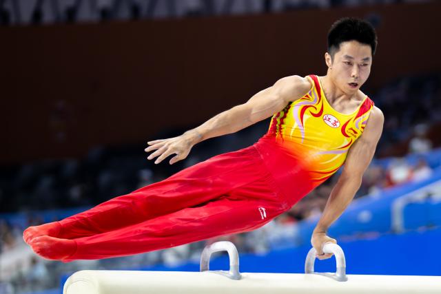 (251112) -- ZHAOQING, Nov. 12, 2025 (Xinhua) -- You Hao of Jiangsu competes in pommel horse during the artistic gymnastics men's team final at China's 15th National Games in Zhaoqing, south China's Guangdong Province, Nov. 12, 2025. (Xinhua/Du Zixuan)