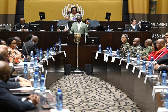 (251112) -- CAPE TOWN, Nov. 12, 2025 (Xinhua) -- South African Finance Minister Enoch Godongwana (at the podium) delivers the Medium-Term Budget Policy Statement in Parliament in Cape Town, South Africa, Nov. 12, 2025. South African Finance Minister Enoch Godongwana has announced a new inflation target of 3 percent, with a 1-percentage-point tolerance band. Delivering the Medium-Term Budget Policy Statement in Parliament on Wednesday, Godongwana said the tolerance band provides flexibility to accommodate any unexpected inflationary shocks. (Photo by Xabiso Mkhabela/Xinhua)