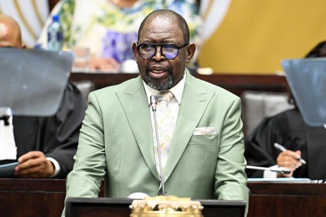 (251112) -- CAPE TOWN, Nov. 12, 2025 (Xinhua) -- South African Finance Minister Enoch Godongwana delivers the Medium-Term Budget Policy Statement in Parliament in Cape Town, South Africa, Nov. 12, 2025. South African Finance Minister Enoch Godongwana has announced a new inflation target of 3 percent, with a 1-percentage-point tolerance band. Delivering the Medium-Term Budget Policy Statement in Parliament on Wednesday, Godongwana said the tolerance band provides flexibility to accommodate any unexpected inflationary shocks. (Photo by Xabiso Mkhabela/Xinhua)