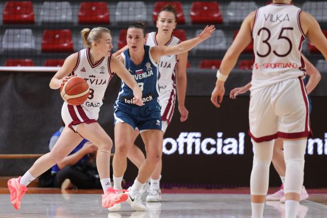 (251113) -- LJUBLJANA, Nov. 13, 2025 (Xinhua) -- Elizabete Bulane (1st L) of Latvia competes during the FIBA Women's EuroBasket 2027 Qualifiers match between Slovenia and Latvia in Ljubljana, Slovenia, Nov. 12, 2025. (Photo by Zeljko Stevanic/Xinhua)