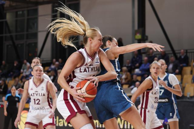 (251113) -- LJUBLJANA, Nov. 13, 2025 (Xinhua) -- Digna Strautmane (front L) of Latvia competes during the FIBA Women's EuroBasket 2027 Qualifiers match between Slovenia and Latvia in Ljubljana, Slovenia, Nov. 12, 2025. (Photo by Zeljko Stevanic/Xinhua)
