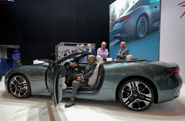 (251113) -- BEIRUT, Nov. 13, 2025 (Xinhua) -- People visit the third edition of the e-Motor Show Middle East in Beirut, Lebanon, Nov. 12, 2025.
  The 7-day expo, which kicked off here on Tuesday, showcases the latest electric and hybrid vehicles from leading automotive brands, along with cutting-edge e-mobility and smart-mobility solutions. (Xinhua/Bilal Jawich)