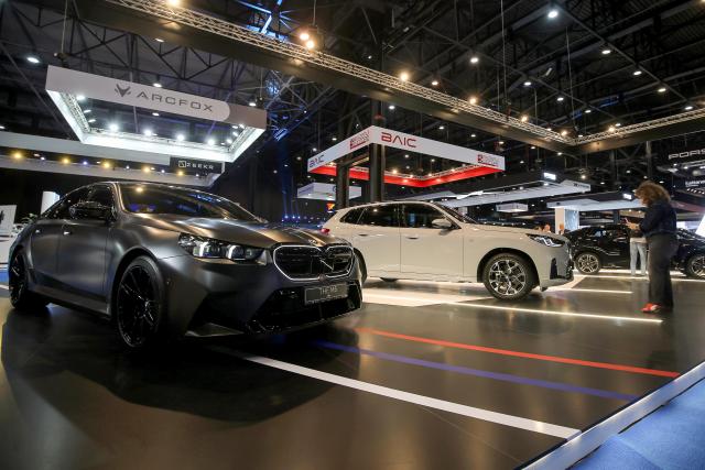 (251113) -- BEIRUT, Nov. 13, 2025 (Xinhua) -- A visitor takes photos at the third edition of the e-Motor Show Middle East in Beirut, Lebanon, Nov. 12, 2025.
  The 7-day expo, which kicked off here on Tuesday, showcases the latest electric and hybrid vehicles from leading automotive brands, along with cutting-edge e-mobility and smart-mobility solutions. (Xinhua/Bilal Jawich)