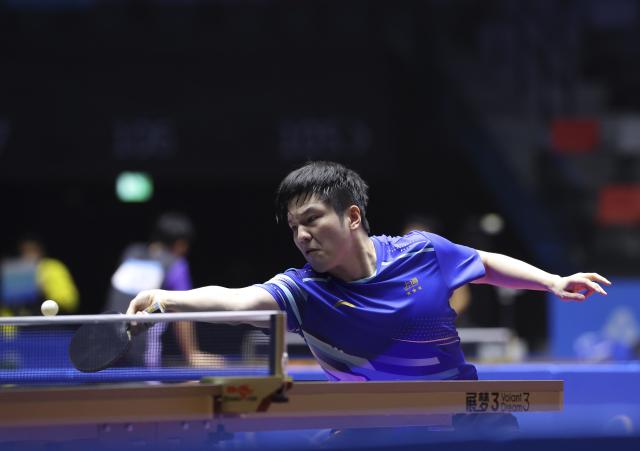 (251113) -- MACAO, Nov. 13, 2025 (Xinhua) -- Fan Zhendong hits a return during the table tennis men's singles quarterfinal match between Fan Zhendong of Shanghai and Sun Zheng of Zhejiang at China's 15th National Games in Macao, south China, Nov. 13, 2025. (Xinhua/Liang Xu)