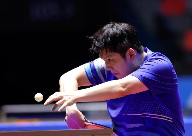 (251113) -- MACAO, Nov. 13, 2025 (Xinhua) -- Fan Zhendong hits a return during the table tennis men's singles quarterfinal match between Fan Zhendong of Shanghai and Sun Zheng of Zhejiang at China's 15th National Games in Macao, south China, Nov. 13, 2025. (Xinhua/Liang Xu)