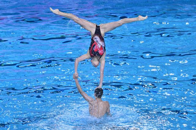 (251113) -- JIANGMEN, Nov. 13, 2025 (Xinhua) -- Team Shanghai perform during the team technical of artistic swimming at China's 15th National Games in Jiangmen, south China's Guangdong Province, Nov. 13, 2025. (Xinhua/Li Xin)