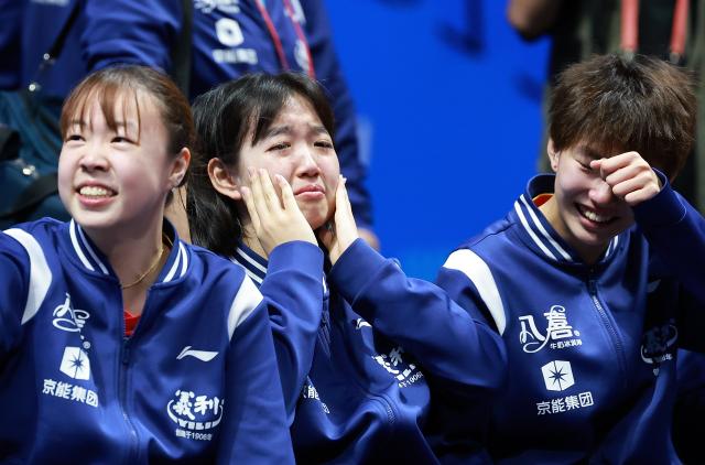(251113) -- MACAO, Nov. 13, 2025 (Xinhua) -- Members of team Beijing react after winning U18 women's team final match of table tennis between Beijing and Shandong at China's 15th National Games in Macao, south China, Nov. 13, 2025. (Xinhua/Liang Xu)