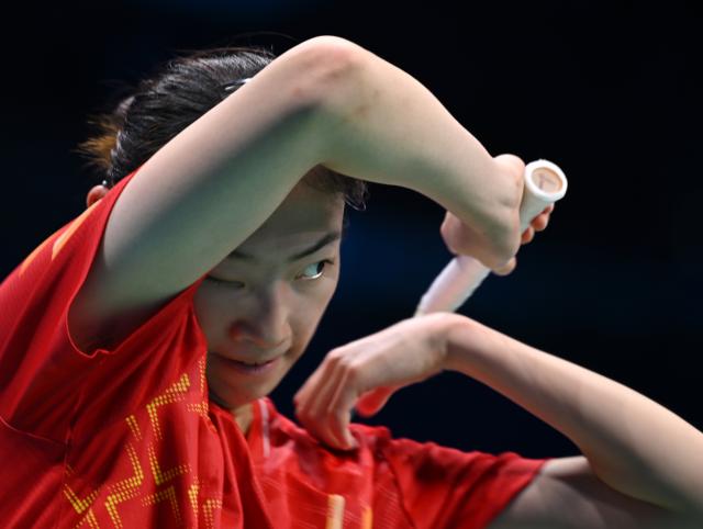(251113) -- SHENZHEN, Nov. 13, 2025 (Xinhua) -- Zhang Leyao of Jiangsu reacts while competing against Wu Xuetong of Guangdong during the U18 women's team final of badminton between Jiangsu and Guangdong at China's 15th National Games in Shenzhen, south China's Guangdong Province, Nov. 13, 2025. (Xinhua/Li He)
