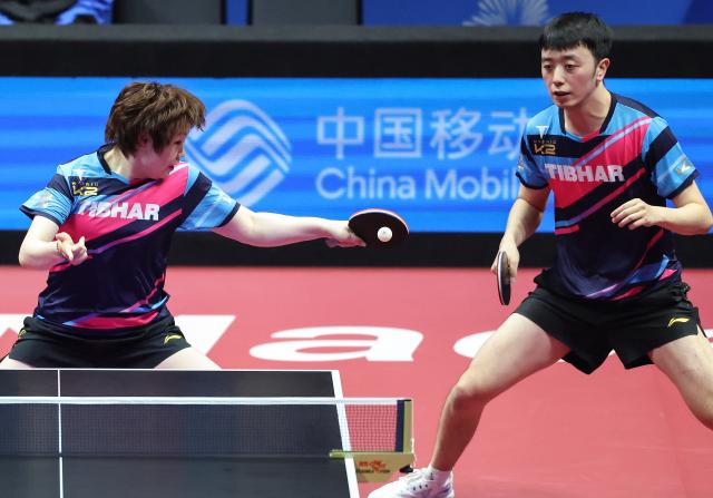(251113) -- MACAO, Nov. 13, 2025 (Xinhua) -- Chen Yuanyu/Kuai Man (L) compete during the table tennis mixed doubles semifinal match between Chen Xingtong/Xu Haidong of Liaoning and Chen Yuanyu/Kuai Man of Jiangsu at China's 15th National Games in Macao, south China, Nov. 13, 2025. (Xinhua/Liu Xu)