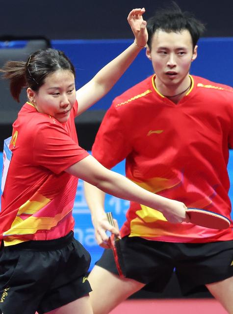 (251113) -- MACAO, Nov. 13, 2025 (Xinhua) -- Chen Xingtong (L)/Xu Haidong compete during the table tennis mixed doubles semifinal match between Chen Xingtong/Xu Haidong of Liaoning and Chen Yuanyu/Kuai Man of Jiangsu at China's 15th National Games in Macao, south China, Nov. 13, 2025. (Xinhua/Liu Xu)
