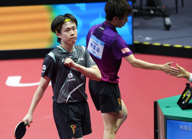 (251113) -- MACAO, Nov. 13, 2025 (Xinhua) -- Wang Chuqin (L) celebrates winning the men's singles quaterfinal match of table tennis between Wang Chuqin of Beijing and Lin Gaoyuan of Guangdong at China's 15th National Games in Macao, south China, Nov. 13, 2025. (Xinhua/Liu Xu)