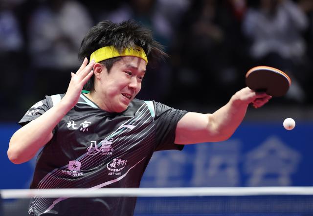 (251113) -- MACAO, Nov. 13, 2025 (Xinhua) -- Wang Chuqin hits a return during the men's singles quaterfinal match of table tennis between Wang Chuqin of Beijing and Lin Gaoyuan of Guangdong at China's 15th National Games in Macao, south China, Nov. 13, 2025. (Xinhua/Liang Xu)