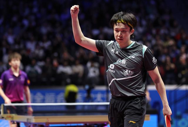 (251113) -- MACAO, Nov. 13, 2025 (Xinhua) -- Wang Chuqin celebrates scoring during the men's singles quaterfinal match of table tennis between Wang Chuqin of Beijing and Lin Gaoyuan of Guangdong at China's 15th National Games in Macao, south China, Nov. 13, 2025. (Xinhua/Liang Xu)