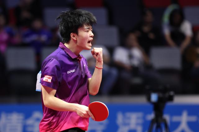 (251113) -- MACAO, Nov. 13, 2025 (Xinhua) -- Feng Zehua of Guangdong celebrates scoring while competing against Huang Youhao of Beijing during the U18 men's team final match of table tennis between Beijing and Guangdong at China's 15th National Games in Macao, south China, Nov. 13, 2025. (Xinhua/Liang Xu)