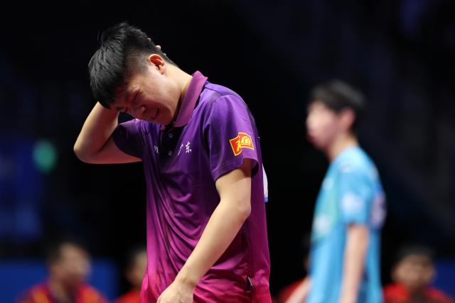 (251113) -- MACAO, Nov. 13, 2025 (Xinhua) -- Huang Xunan of Guangdong reacts while competing against Chen Hengda of Beijing during the U18 men's team final match of table tennis between Beijing and Guangdong at China's 15th National Games in Macao, south China, Nov. 13, 2025. (Xinhua/Liang Xu)